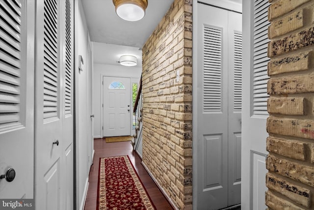 doorway featuring dark wood-style flooring