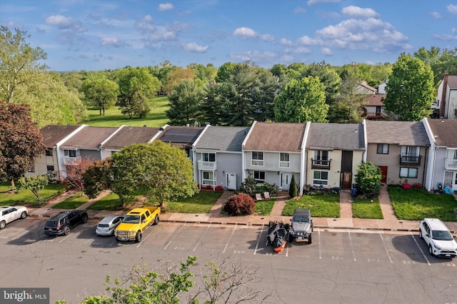 birds eye view of property with a residential view