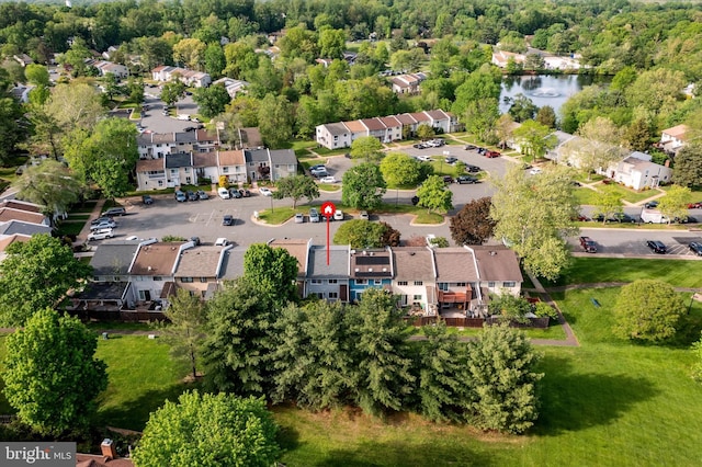birds eye view of property featuring a water view and a residential view