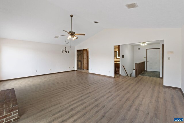 unfurnished living room with a ceiling fan, baseboards, wood finished floors, and lofted ceiling