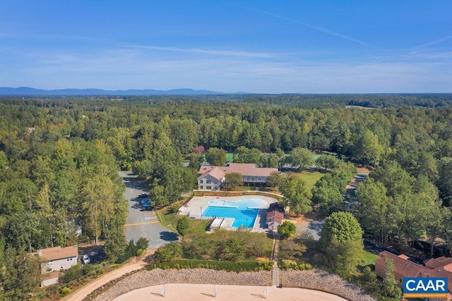 bird's eye view featuring a wooded view