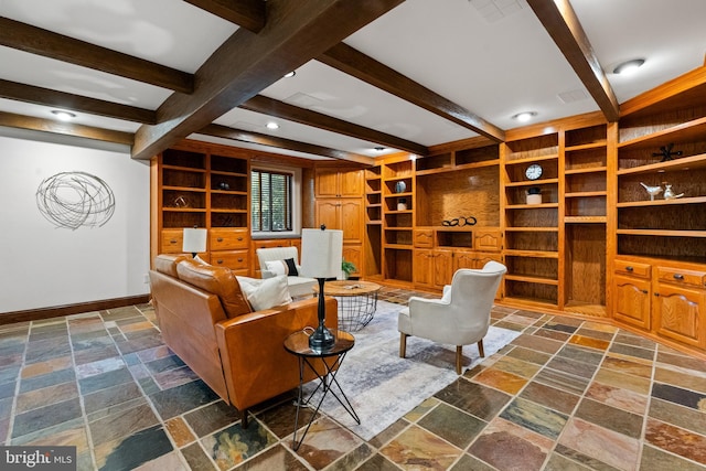 living area featuring stone tile flooring, baseboards, beamed ceiling, recessed lighting, and built in shelves