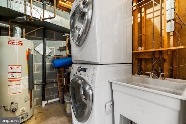 laundry area with estacked washer and dryer and gas water heater