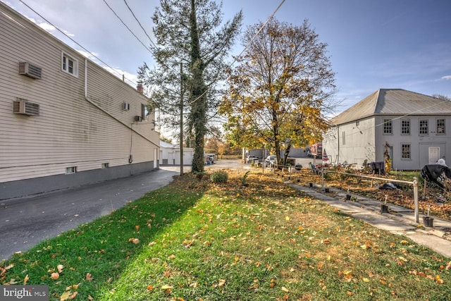 view of yard featuring a wall unit AC