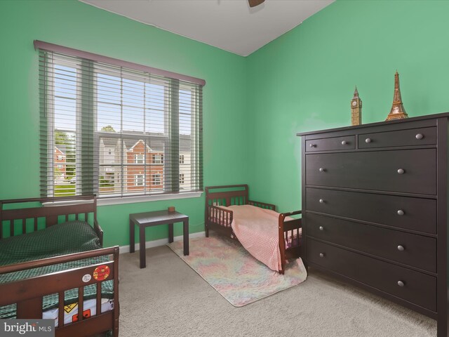 bedroom with carpet and baseboards
