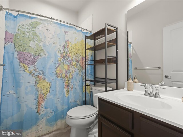 full bath with toilet, vanity, tile patterned floors, and a shower with shower curtain