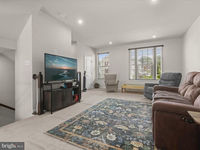 carpeted living room with recessed lighting and baseboards