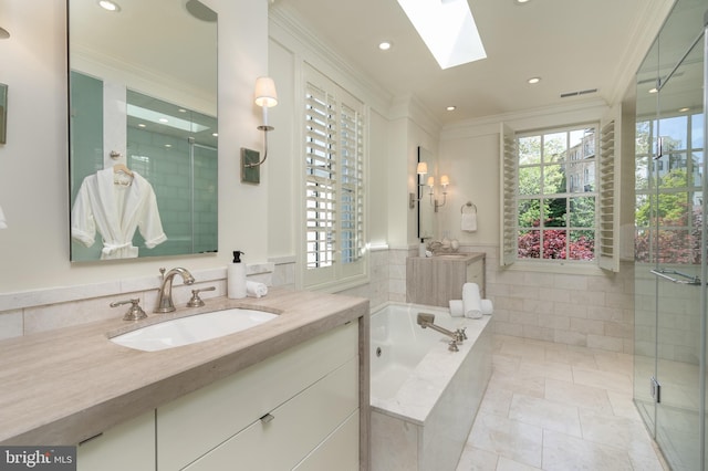 full bathroom featuring a skylight, ornamental molding, a stall shower, and a bath