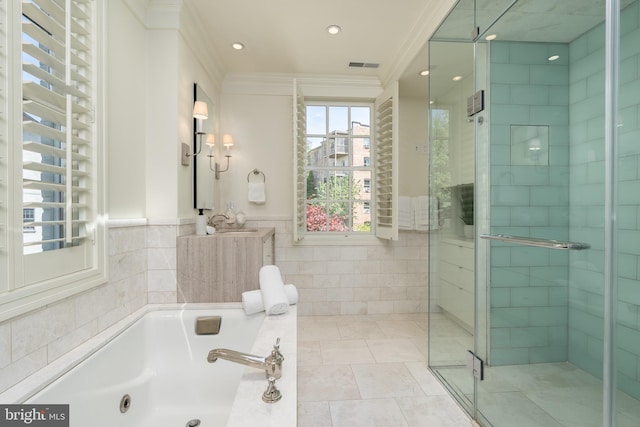 bathroom with tile walls, ornamental molding, visible vents, and a stall shower