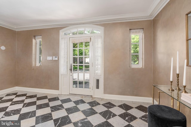 entryway with baseboards, ornamental molding, and tile patterned floors