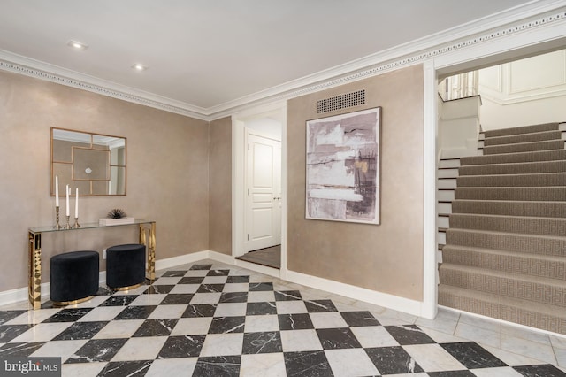 entrance foyer with baseboards, ornamental molding, stairs, and visible vents
