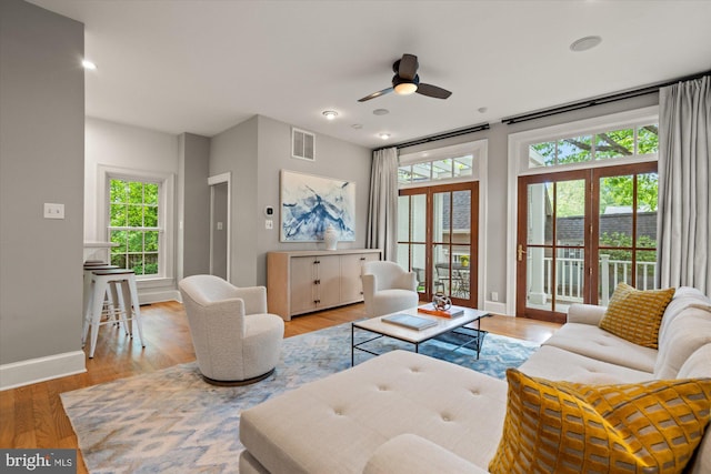 6763 25th St N, Arlington, VA 22213 - living room featuring plenty of natural light, baseboards, a ceiling fan, light wood-style flooring, and recessed lighting