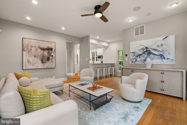 6763 25th St N, Arlington, VA 22213 - living room with wood finished floors, a ceiling fan, and recessed lighting