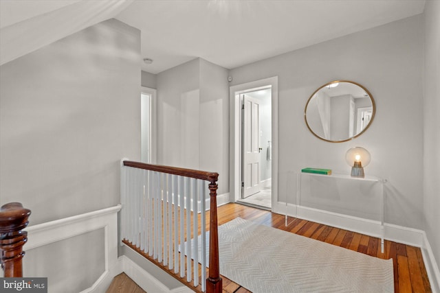 6763 25th St N, Arlington, VA 22213 - hall with hardwood / wood-style floors, baseboards, and an upstairs landing