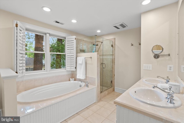 6763 25th St N, Arlington, VA 22213 - full bath with tile patterned floors, a bath, a stall shower, recessed lighting, and double vanity
