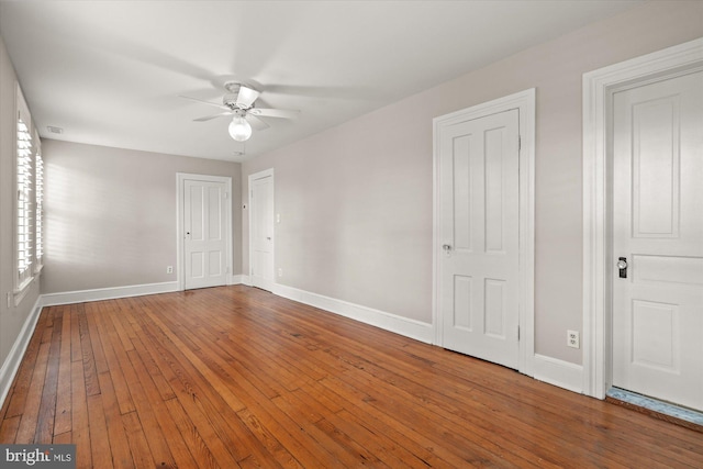 6763 25th St N, Arlington, VA 22213 - unfurnished bedroom with baseboards, wood-type flooring, and ceiling fan