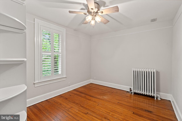 6763 25th St N, Arlington, VA 22213 - spare room with radiator heating unit, wood-type flooring, baseboards, and a ceiling fan