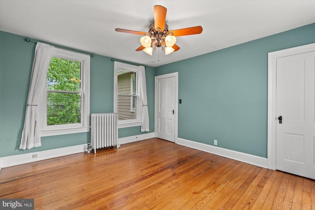6763 25th St N, Arlington, VA 22213 - spare room with radiator heating unit, baseboards, ceiling fan, and light wood-style floors