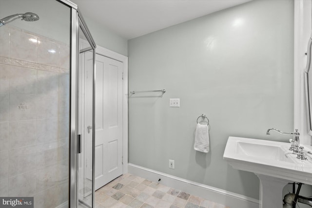 6763 25th St N, Arlington, VA 22213 - full bathroom with a stall shower, baseboards, tile patterned floors, and a sink