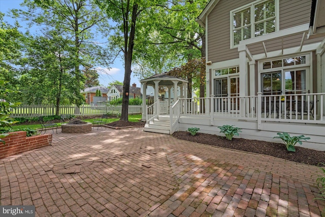 6763 25th St N, Arlington, VA 22213 - view of patio / terrace with an outdoor fire pit, a gazebo, and fence