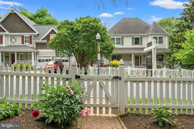 6763 25th St N, Arlington, VA 22213 - victorian home with a fenced front yard, a garage, a shingled roof, and a gate