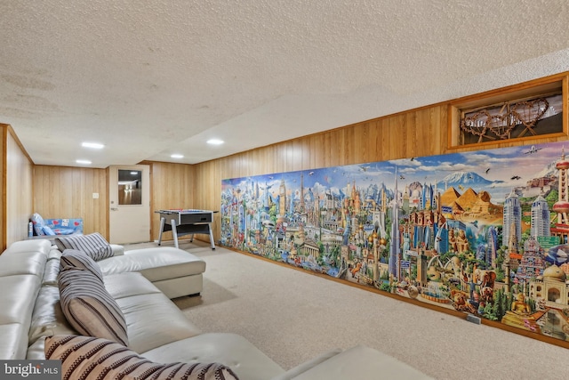 carpeted living room with a textured ceiling and wooden walls