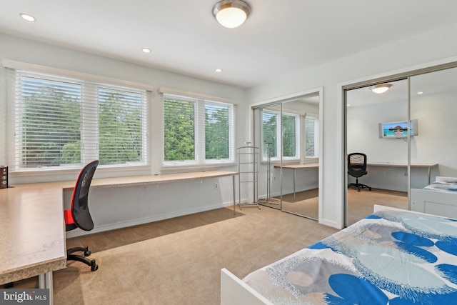 carpeted bedroom with multiple closets, an office area, recessed lighting, and baseboards