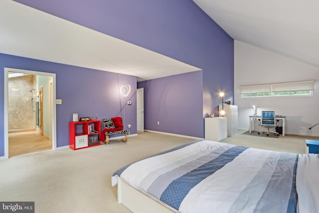 bedroom featuring carpet floors, baseboards, high vaulted ceiling, and ensuite bathroom