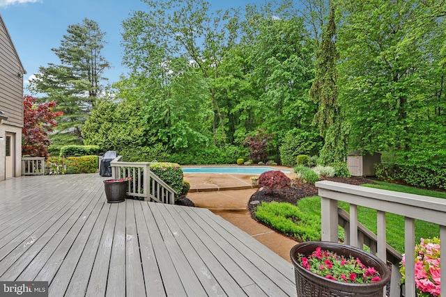 deck featuring an outdoor pool