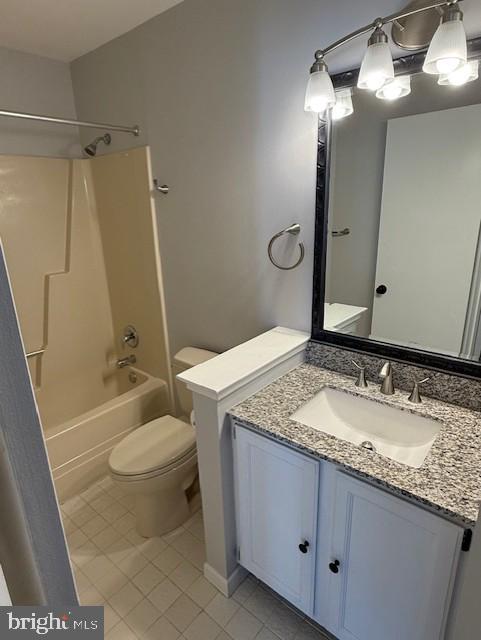 full bathroom with toilet, shower / bath combination, tile patterned flooring, and vanity