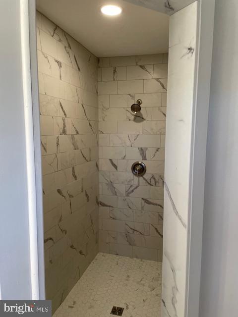 bathroom with a shower stall