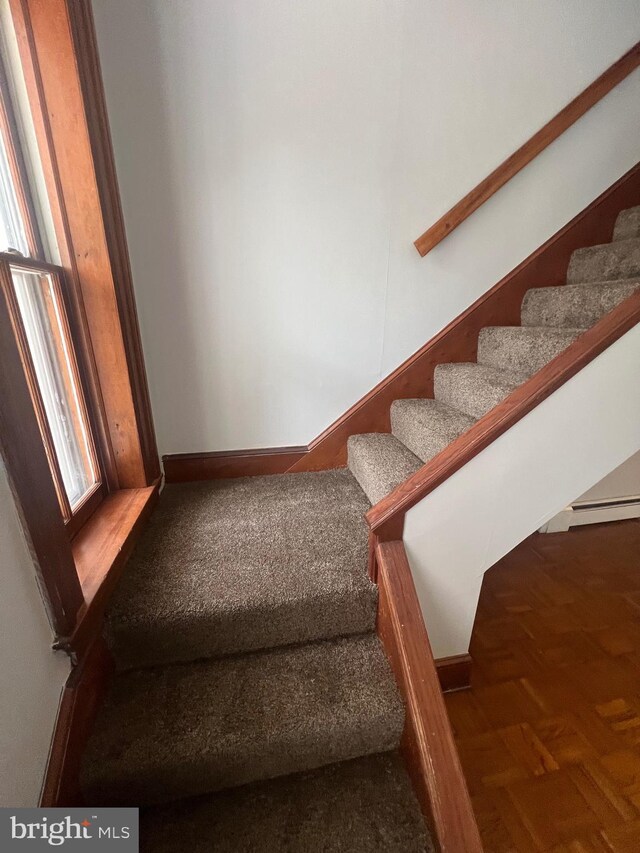 staircase with baseboards
