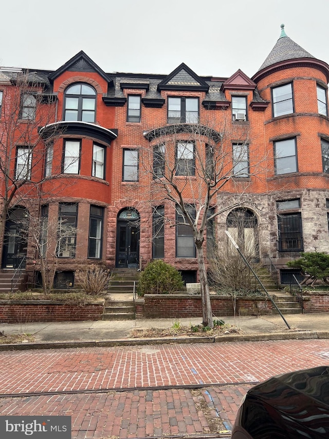 view of property with brick siding