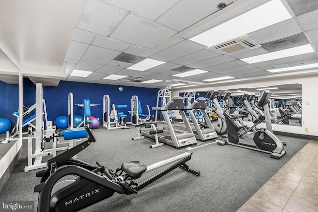1000 Fell St Unit 633, Baltimore, MD 21231 - exercise room with a paneled ceiling and baseboards