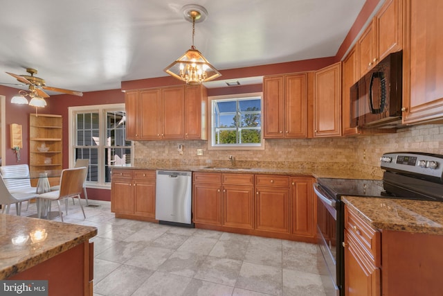 kitchen featuring appliances with stainless steel finishes, brown cabinetry, a sink, and tasteful backsplash