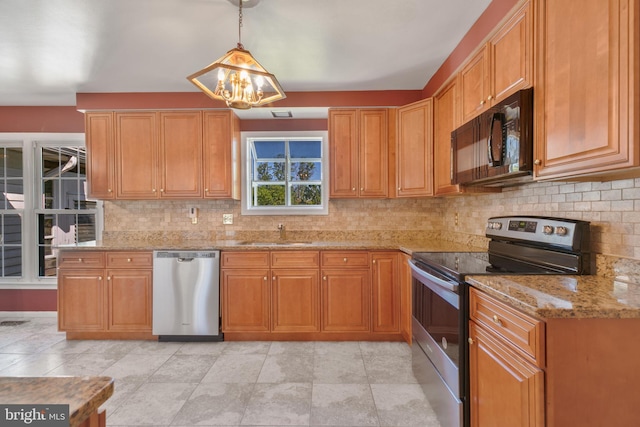 kitchen with a chandelier, appliances with stainless steel finishes, decorative backsplash, and a sink
