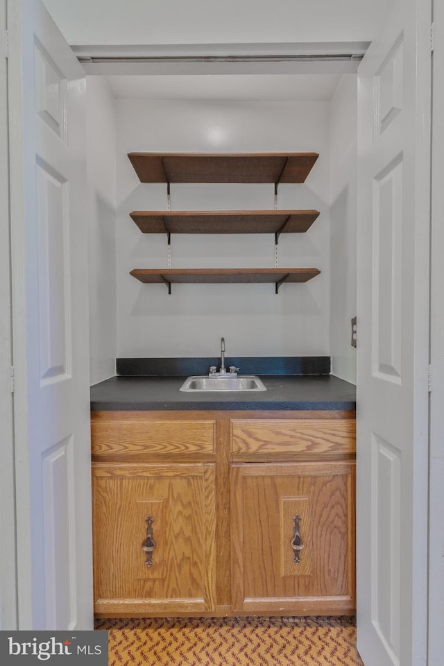 bar with a sink and wet bar