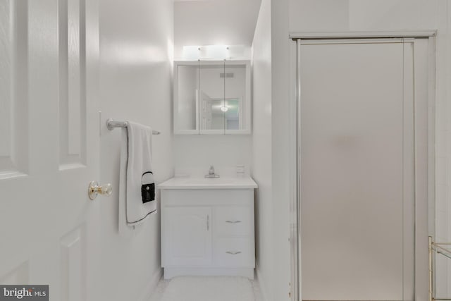 bathroom featuring vanity and baseboards