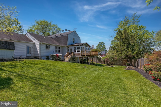 view of yard featuring stairway, fence, and a wooden deck