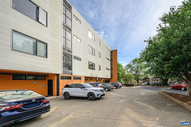 211 Cream St Unit 202, Charlottesville, VA 22903 - view of building exterior with uncovered parking
