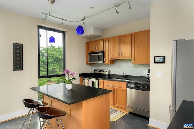 211 Cream St Unit 202, Charlottesville, VA 22903 - kitchen featuring appliances with stainless steel finishes, a sink, decorative backsplash, baseboards, and dark countertops