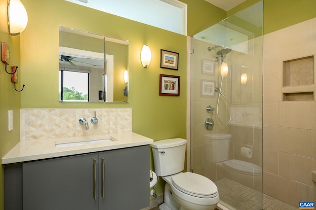 211 Cream St Unit 202, Charlottesville, VA 22903 - full bath with backsplash, tiled shower, toilet, vanity, and a ceiling fan
