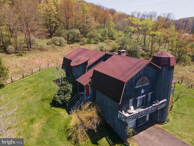 birds eye view of property with a forest view