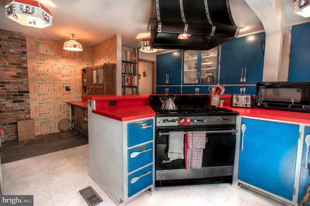 kitchen featuring blue cabinets, visible vents, black microwave, gas range, and extractor fan