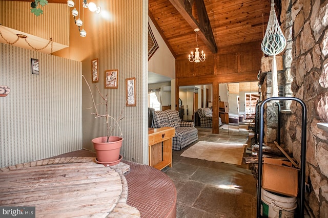 foyer featuring stone tile flooring, wood ceiling, high vaulted ceiling, and beamed ceiling