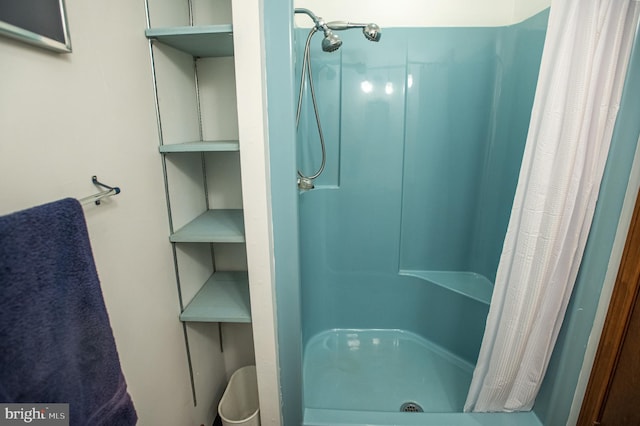 bathroom with a shower with shower curtain