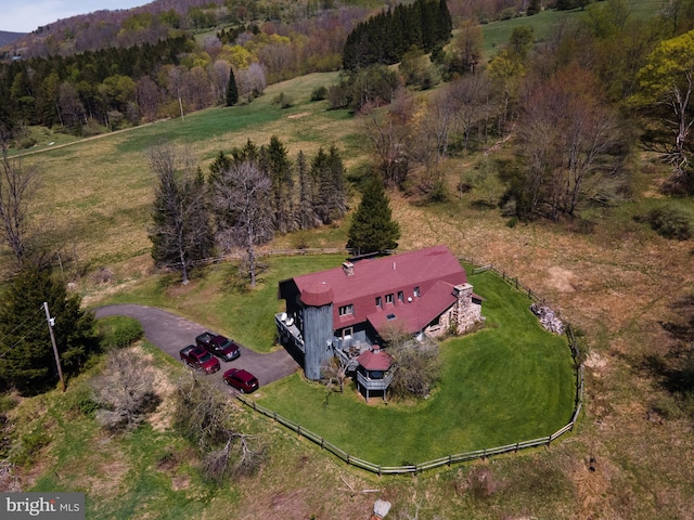 birds eye view of property with a rural view and a forest view