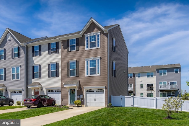 504 Sammy St, Woolwich Twp, NJ 08085 - townhome / multi-family property featuring a garage, fence, driveway, and a front lawn