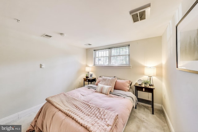 bedroom featuring baseboards, light carpet, and visible vents