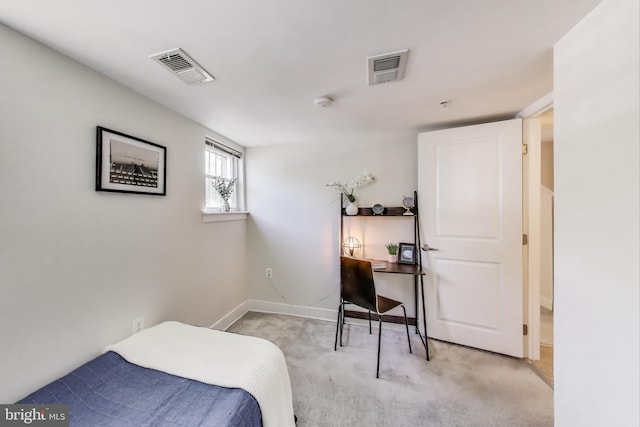 bedroom featuring baseboards, light carpet, and visible vents